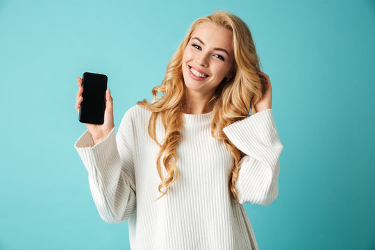 Portrait of a beautiful young blonde woman in sweater