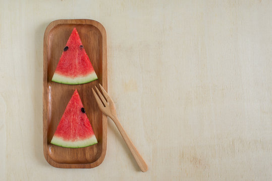 Watermelon in plate on the wooden table