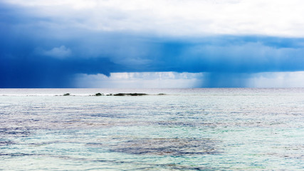 The rain cloud hovered over the sea, Male, Maldives. Copy space for text.