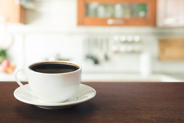 Hot coffee on tabletop in modern kitchen. Close up.