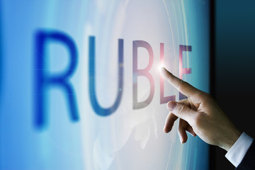 Businessman touching the screen about ruble