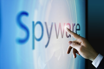 Fototapeta na wymiar Businessman touching the screen about spyware