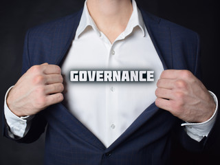 On the businessman's chest is an inscription:GOVERNANCE