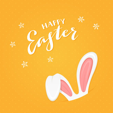 Orange background with rabbit ears and text Happy Easter