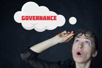 Above the businessman hangs a cloud with the inscription:GOVERNANCE