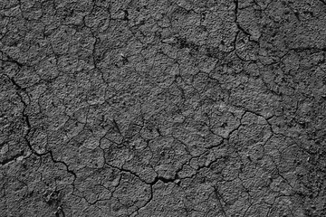 Brown dry soil or cracked ground texture background.