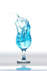 water splash in glasses on white background