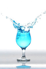 water splash in glasses on white background