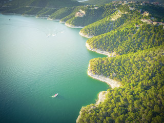 Vintage aerial trees and cliff rock wall, bluffs at Lake Travis, Austin, Texas, USA. Luxury...