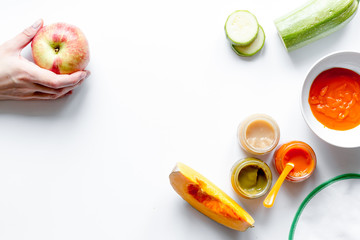 cooking vegetable puree for baby on white background top view