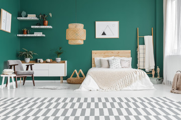 Spacious green bedroom interior