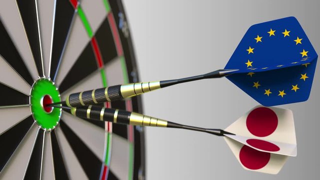 Flags of the European Union and Japan on darts hitting bullseye of the target. International cooperation or competition conceptual animation