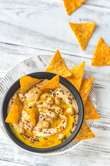 Bowl of hummus with tortilla chips