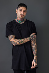 Handsome tattooed man portrait wearing black t-shirt
