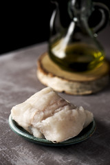 raw codfish on a wooden table