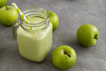 Healthy detox green smoothie in a mason jar.