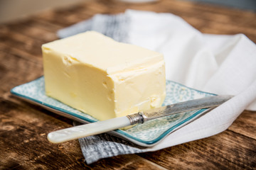 A piece of square natural milk butter 
