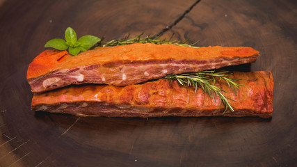 whole-smoked pork rib on rustic table