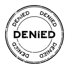 Grunge black denied round rubber seal stamp on white background