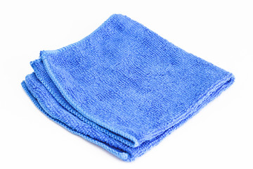 Blue folded microfiber cloth on white background