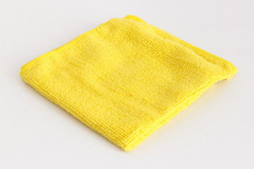 Yellow folded microfiber cloth on white background - 198479402