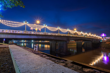 The color of the lights on the bridge in Phitsanulok, Thailand.
