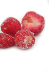 Frozen strawberries isolated on white background