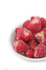 Frozen strawberries isolated on white background