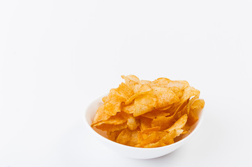 Crispy potato chips in bowl isolated on background