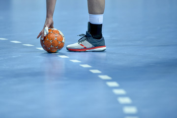 handball ball laying on the 9 meters dotted line on the pitch - obrazy, fototapety, plakaty