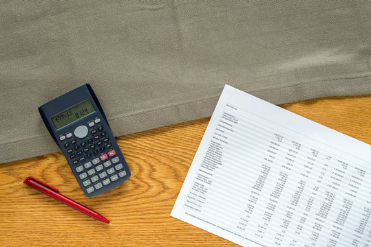 Template of financial accounting desk with calculator and german statistics from above