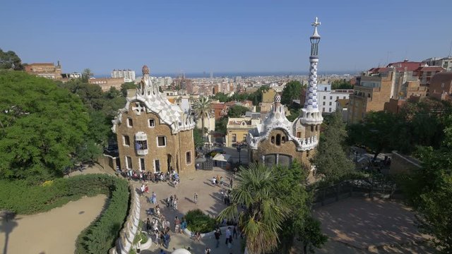 Building with mosaic roof and tower in Park Guell