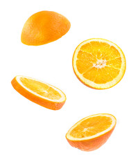 Creative concept with Flying orange. Sliced orange isolated on white background. Levity fruit floating in the air.