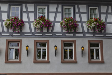 Fototapeta na wymiar Beautiful wall with windows of an old historic half-timbered house