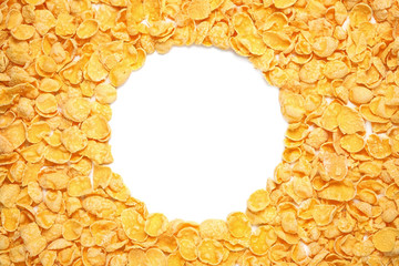 Pile of cornflakes isolated on white with round copy space. Top view.