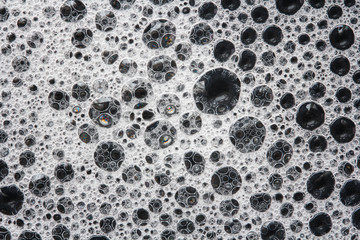 soap foam on a black background