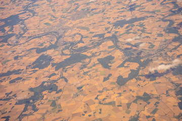 The land on earth viewed from aeroplane in sky with clouds, Spain