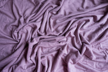 Rumpled simple pink viscose fabric from above