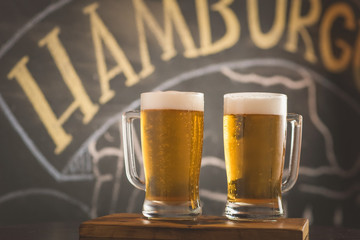 two mugs of chopp on the table