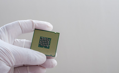 Technician holding computer chipset processor