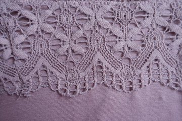 Macro of pink viscose fabric with lace