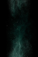 Green dust on a black background. Fine particles in motion. - 198490264
