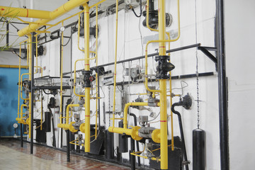 Manufacturing site - yellow tubes and pressure gauges
