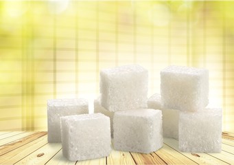 Cubes of sugar on desk