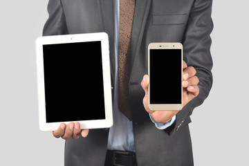 Man holding tablet pc with blank screen and mobile blank screen