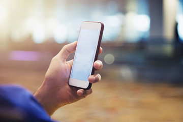 Modern connection technology concept. Businessman using smartphone or mobile to connect to people in city. E-commerce, online business.