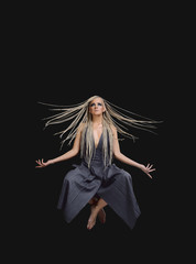 Young woman yogi levitation and meditation concept.