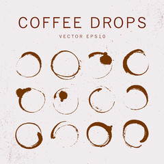 Vector collection of artistic round hand made coffee stains isolated on textured background. Perfect for coffee shop packaging design, emblems, insignia, etc.