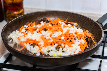 Beef stew with vegetables in frying pan