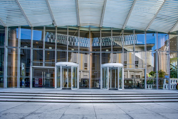 The entrance of the modern Enterprise Building, in the face view of the blue tone.